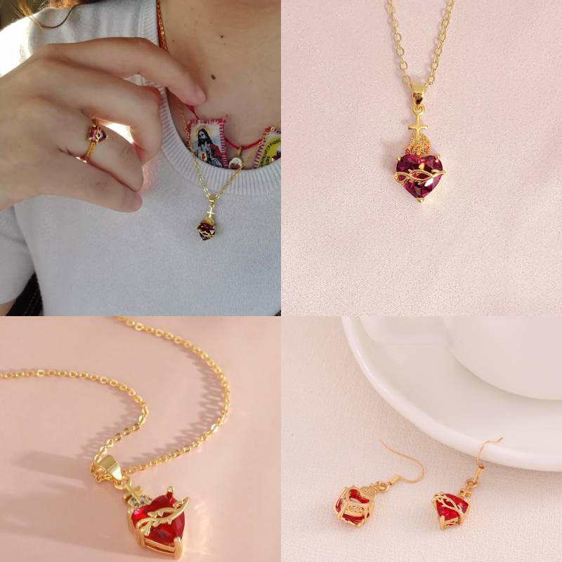 A red heart-shaped cross heart necklace with a chain