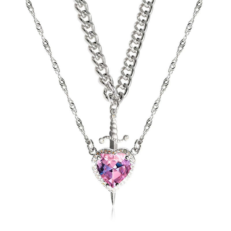 A red heart-shaped cross heart necklace with a chain