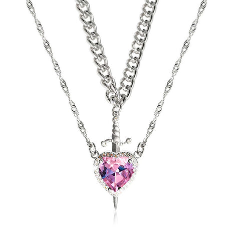 A red heart-shaped cross heart necklace with a chain