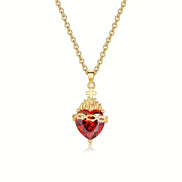A red heart-shaped cross heart necklace with a chain