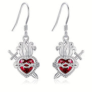 A red heart-shaped cross heart necklace with a chain