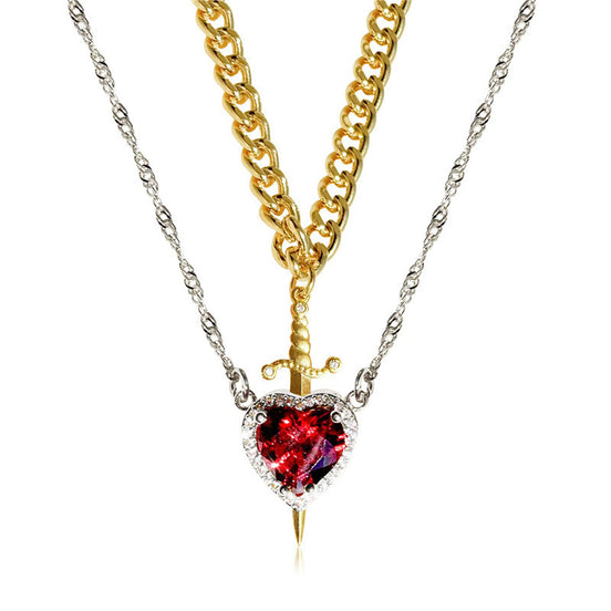 A red heart-shaped cross heart necklace with a chain