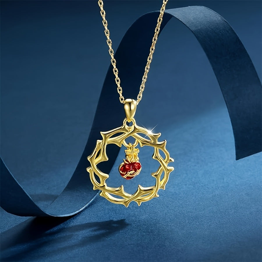 A red heart-shaped cross heart necklace with a chain