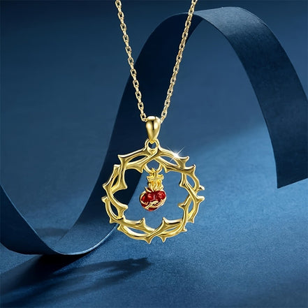 A red heart-shaped cross heart necklace with a chain