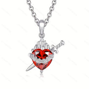 A red heart-shaped cross heart necklace with a chain