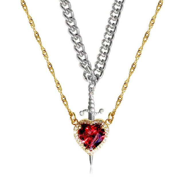 A red heart-shaped cross heart necklace with a chain