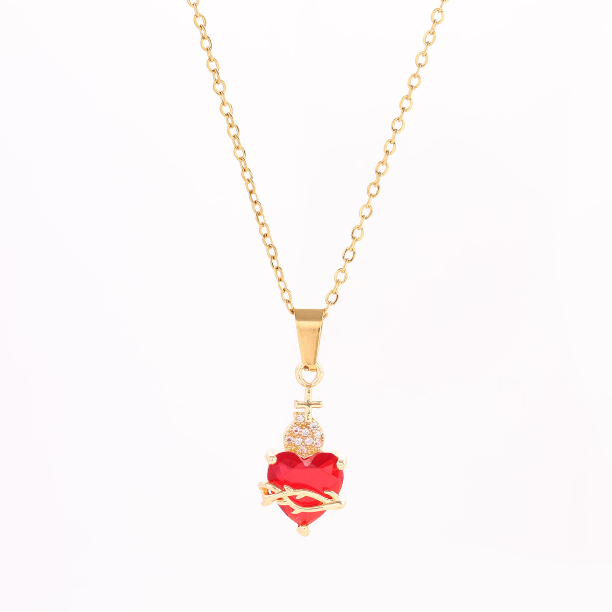A red heart-shaped cross heart necklace with a chain
