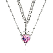 A red heart-shaped cross heart necklace with a chain