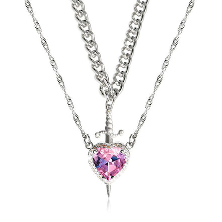 A red heart-shaped cross heart necklace with a chain