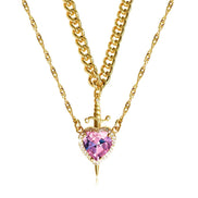 A red heart-shaped cross heart necklace with a chain