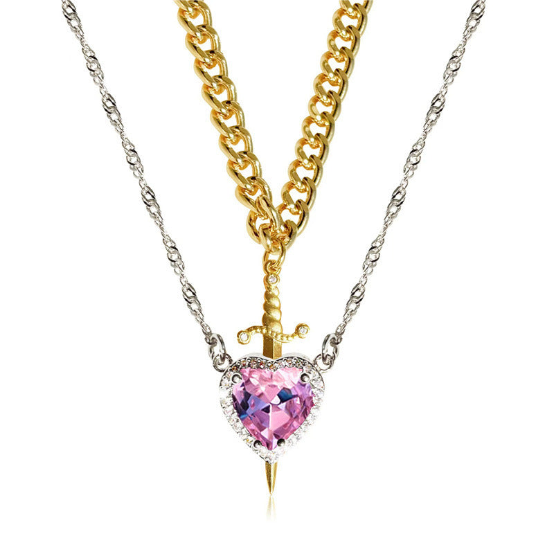 A red heart-shaped cross heart necklace with a chain