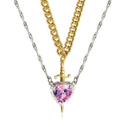 A red heart-shaped cross heart necklace with a chain