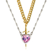A red heart-shaped cross heart necklace with a chain